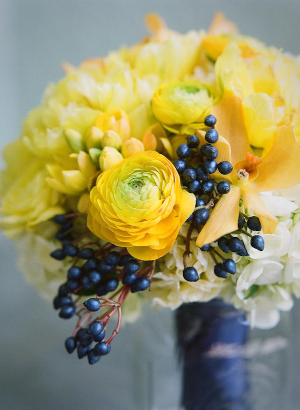 Striking yellow and blue bridal bouquet - wedding photo by top Austin based wedding photographers Q Weddings